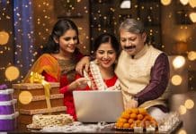 The tyranny of a distanced Diwali indian family looking at a laptop