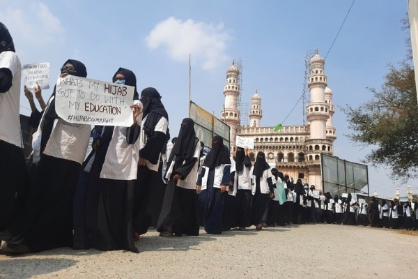 Caption: Students from Nizamia Unani Tibbi College and Anwarul Uloom College in Hyderabad on Wednesday staged a protest in solidarity with the students opposing ban on #Hijab in educational institutions in #Karnataka. (IANS)