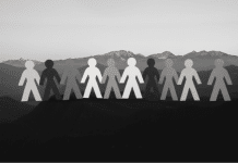 Greyscale silhouettes on top of mountain landscape
