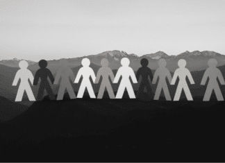 Greyscale silhouettes on top of mountain landscape